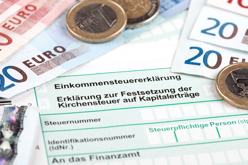 German Tax Form with Euro banknotes and coins